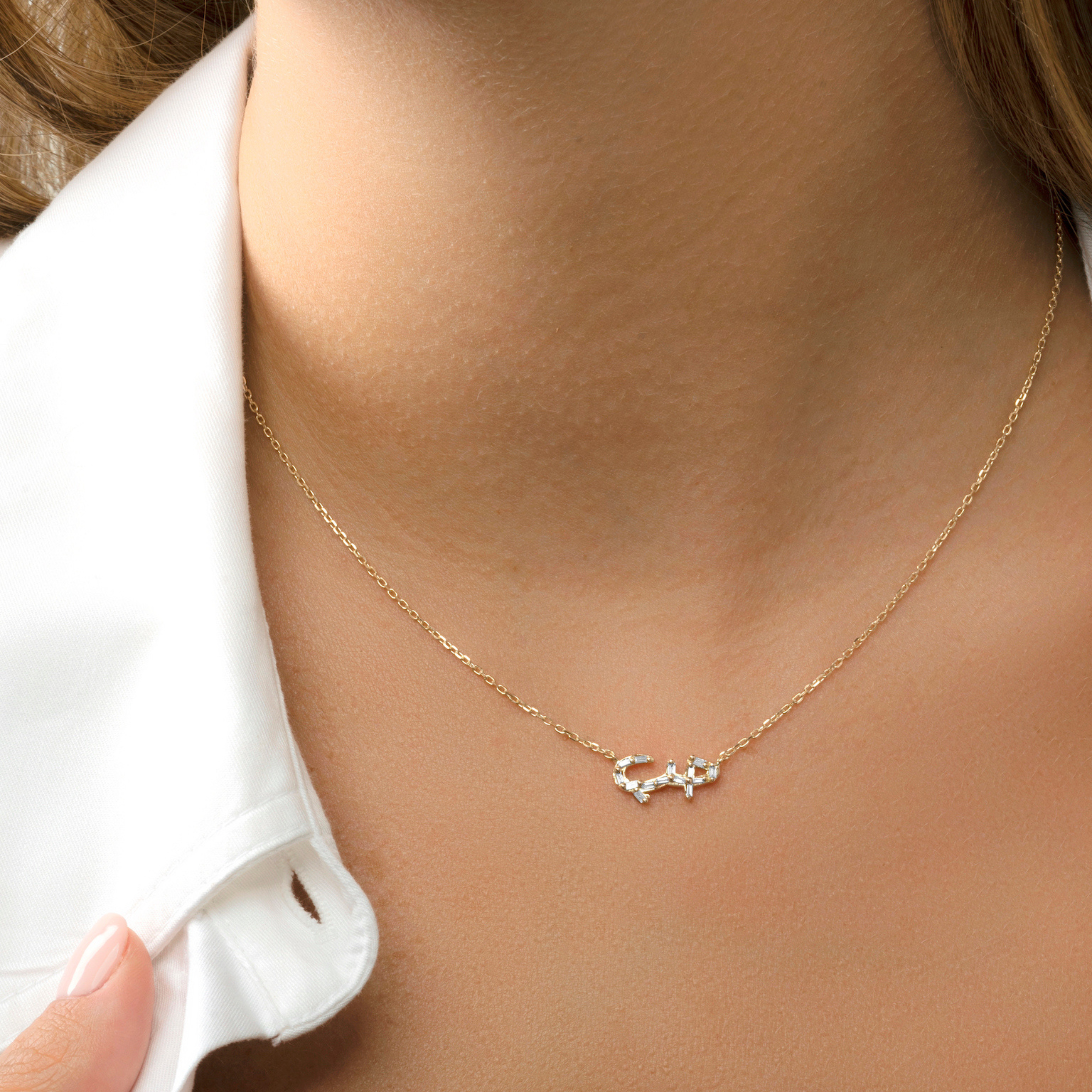 HOBB — 18K Gold Baguette Diamond “Love” Pendant